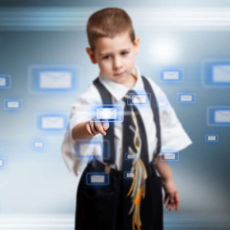 Little business boy pressing messaging type of modern iconsの写真素材