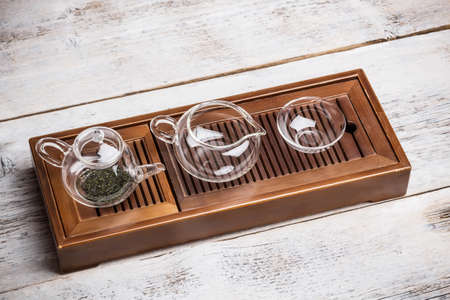 Empty glass teapot and cupの写真素材