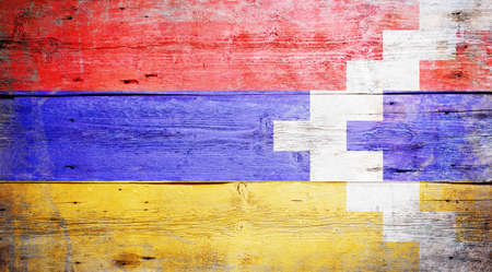 Flag of Nagorno-Karabakh painted on grungy wood plank backgroundの写真素材