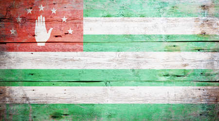 Flag of Abkhazia painted on grungy wood plank backgroundの写真素材