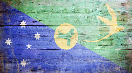 Flag of Christmas Island painted on grungy wood plank backgroundの写真素材
