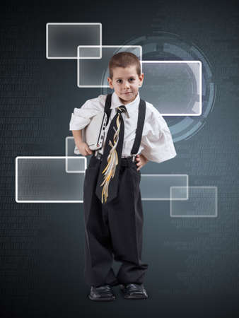 Little  boy dressed in oversized business clothes on digital backgroundの写真素材