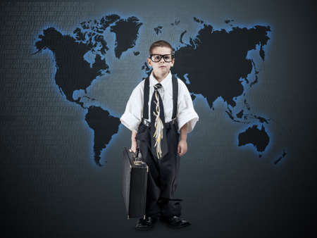 Digital concept with little business boy in frontの写真素材