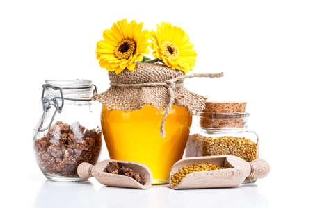 Still life of jars of honey, pollen and propolisの写真素材
