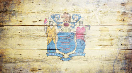 Flag of New Jersey painted on grungy wooden backgroundの写真素材
