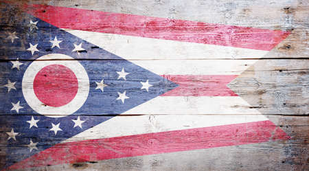 Flag of Ohio painted on grungy wooden backgroundの写真素材