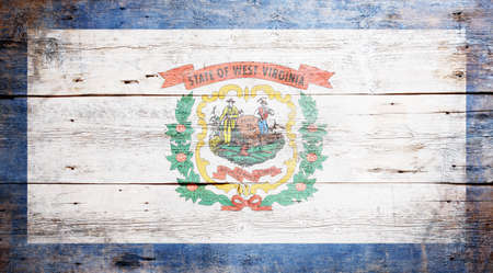 Flag of the state of West Virginia painted on grungy wooden backgroundの写真素材