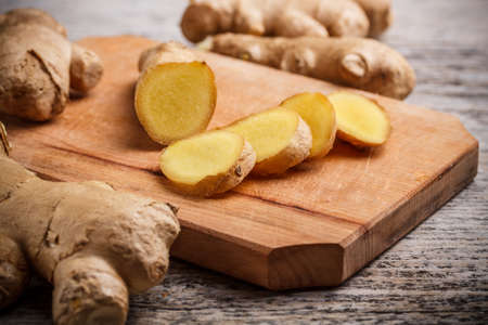 Ginger root on a wood cutting boardの写真素材