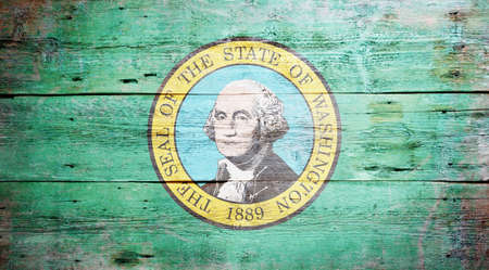 Flag of the state of Washington painted on grungy wooden backgroundの写真素材