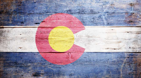 Flag of the state of Colorado painted on grungy wooden backgroundの写真素材