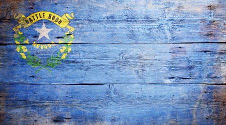 Flag of the state of Nevada painted on grungy wooden backgroundの写真素材