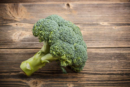 Fresh and healthy organic broccoli on rustic wooden tableの写真素材