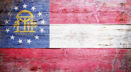 Flag of the U.S. state of Georgia painted on grungy wooden backgroundの写真素材