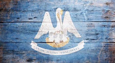 Flag of Louisiana painted on grungy wooden backgroundの写真素材