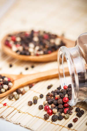Peppercorn mix in wooden spoon