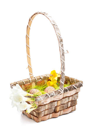 Easter basket with egg on white backgroundの写真素材