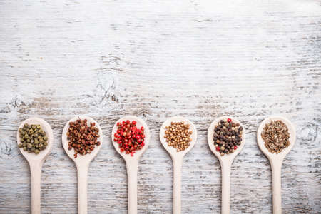 Collection of spices on a wooden spoonの写真素材
