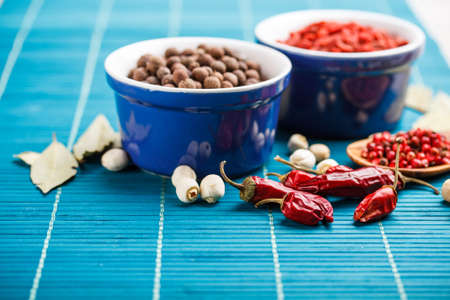 Allspice in blue ceramic bowlの写真素材
