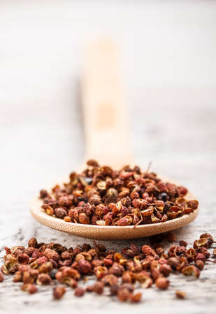 Sichuan pepper in wooden spoonの写真素材