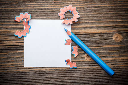 Sharpened blue color pencil with paper and wood shavings の写真素材
