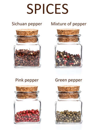 Four jars of spices isolated over white の写真素材