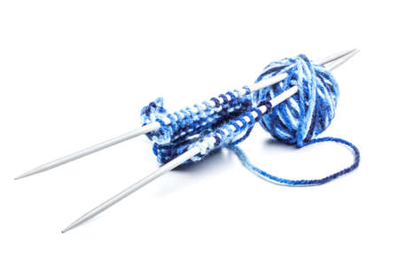 Knitting, skein and needles on a white background の写真素材