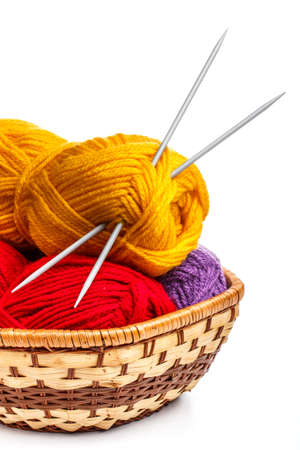 Knitting yarn balls and needles in basketの写真素材