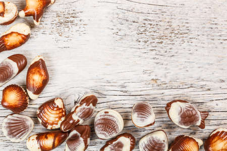 Frame of chocolate seashell candiesの写真素材