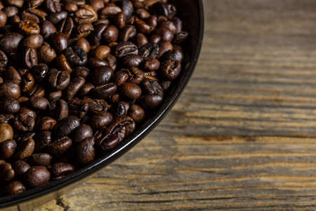 Coffee in plate on grunge wooden backgroundの写真素材