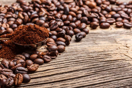 Fresh coffee beans on wooden backgroundの写真素材