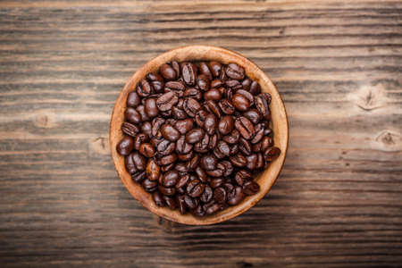 Coffee beans in wooden bowlの写真素材