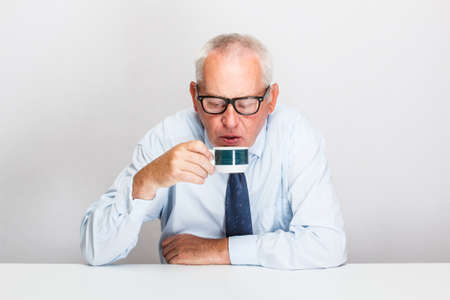 Senior businessman taking a breakの写真素材