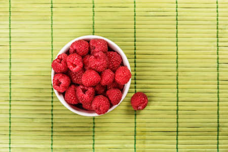 Fresh raspberry on green napkin