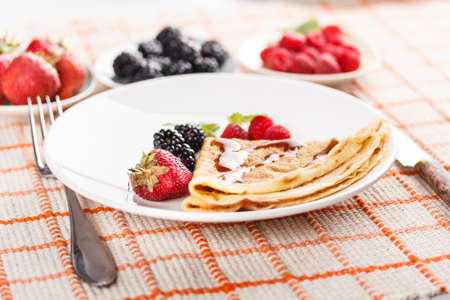 Fresh homemade pancakes with fruitsの写真素材