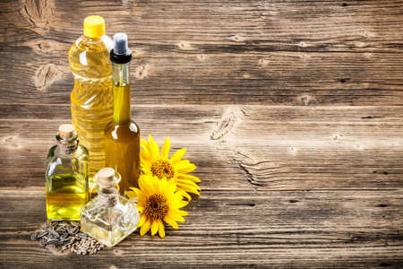 Bottle of sunflower oil with flowerの写真素材
