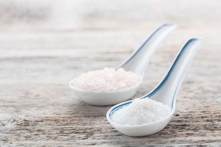 Rock salt in a ceramics spoons の写真素材
