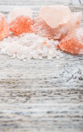Himalayan pink crystal salt on wooden board