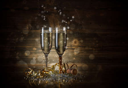Two glass with champagne on a wooden backgroundの写真素材