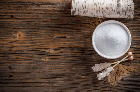 Top view of xylitol on weathered wooden boardの写真素材