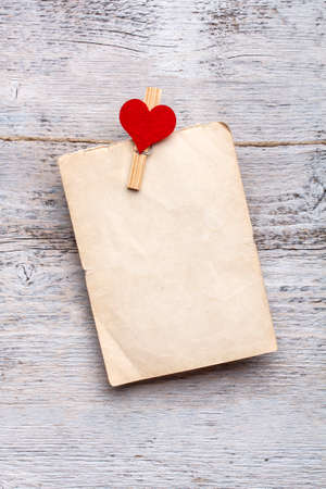 Blank paper cards hanging on clothespinsの写真素材