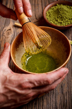 Matcha tea prepared with bamboo whiskの写真素材