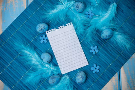 Easter concept with blank note and quail eggsの写真素材
