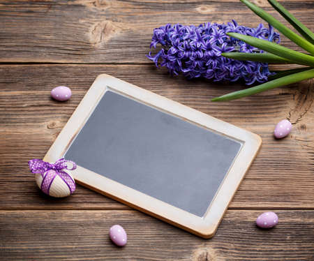Easter concept. Eggs and blackboard blankの写真素材