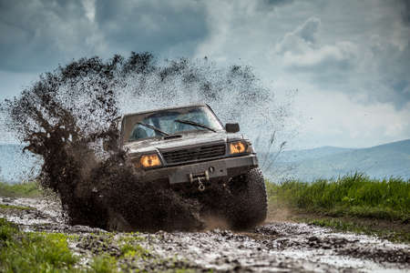Jeep off road in muddy conditionsの写真素材