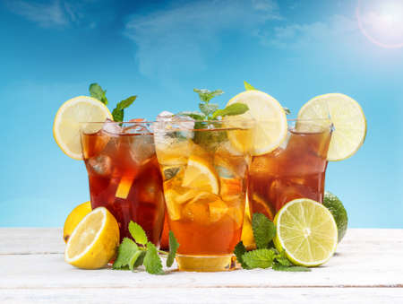 Fresh and cold ice tea with sliced lemon and mint の写真素材