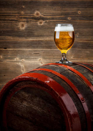 Beer and barrel on wooden background の写真素材