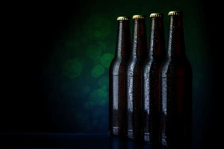 The group of wet bottles of beer  