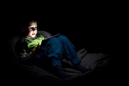 Boy looking at digital tablet 