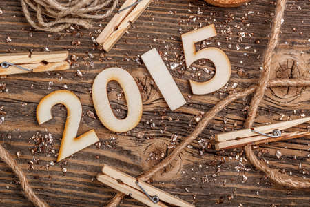 New Year 2015 concept on a rustic wooden background 