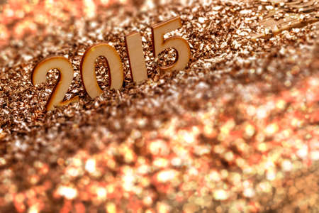 2015 wooden number on golden glittering background の写真素材
